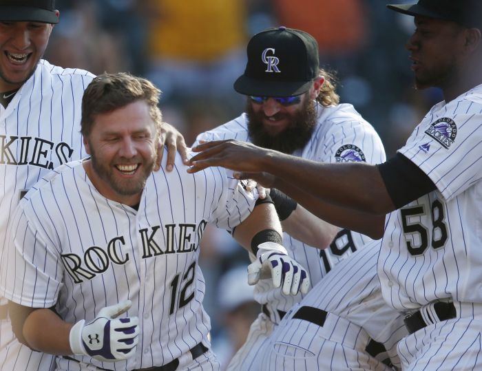 Complete with bushy beard and mullet, Blackmon leads Rockies